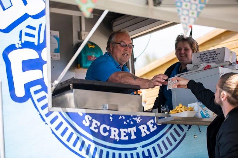 Alfresco mobile catering van serving customers